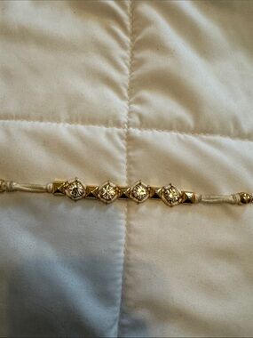 Juicy Couture Gold-Tone Crystal Cord Bracelet in Cream